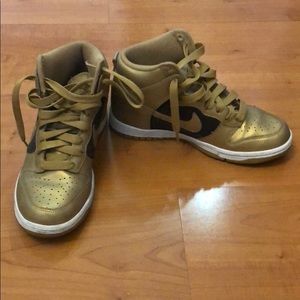 gold and black nike high tops
